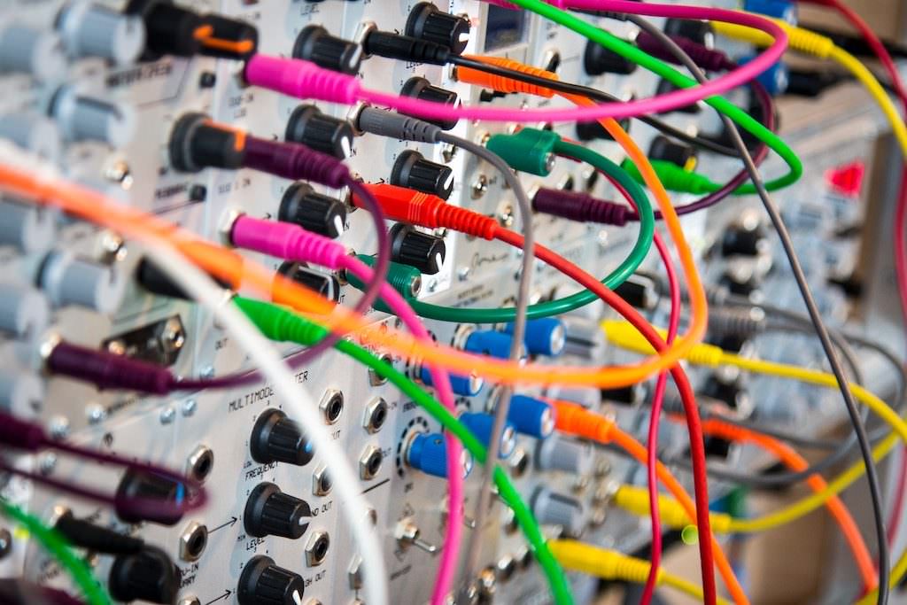 Colorful wires and electronic components on a circuit board.